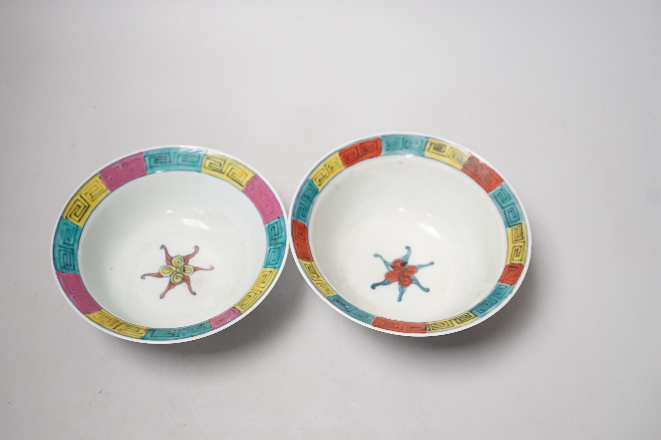 A near pair of Chinese doucai bowls. Tallest 7cm